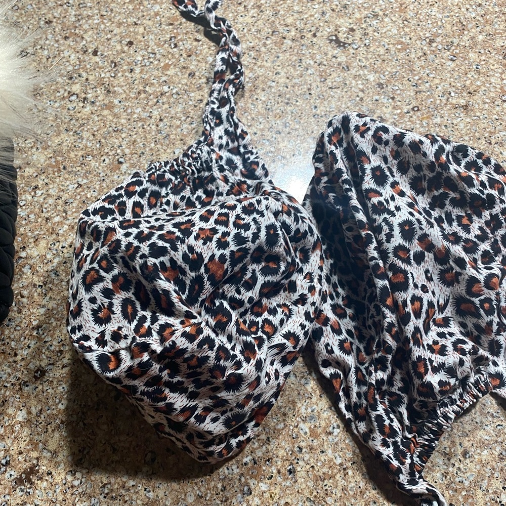 Two leopard scrub caps